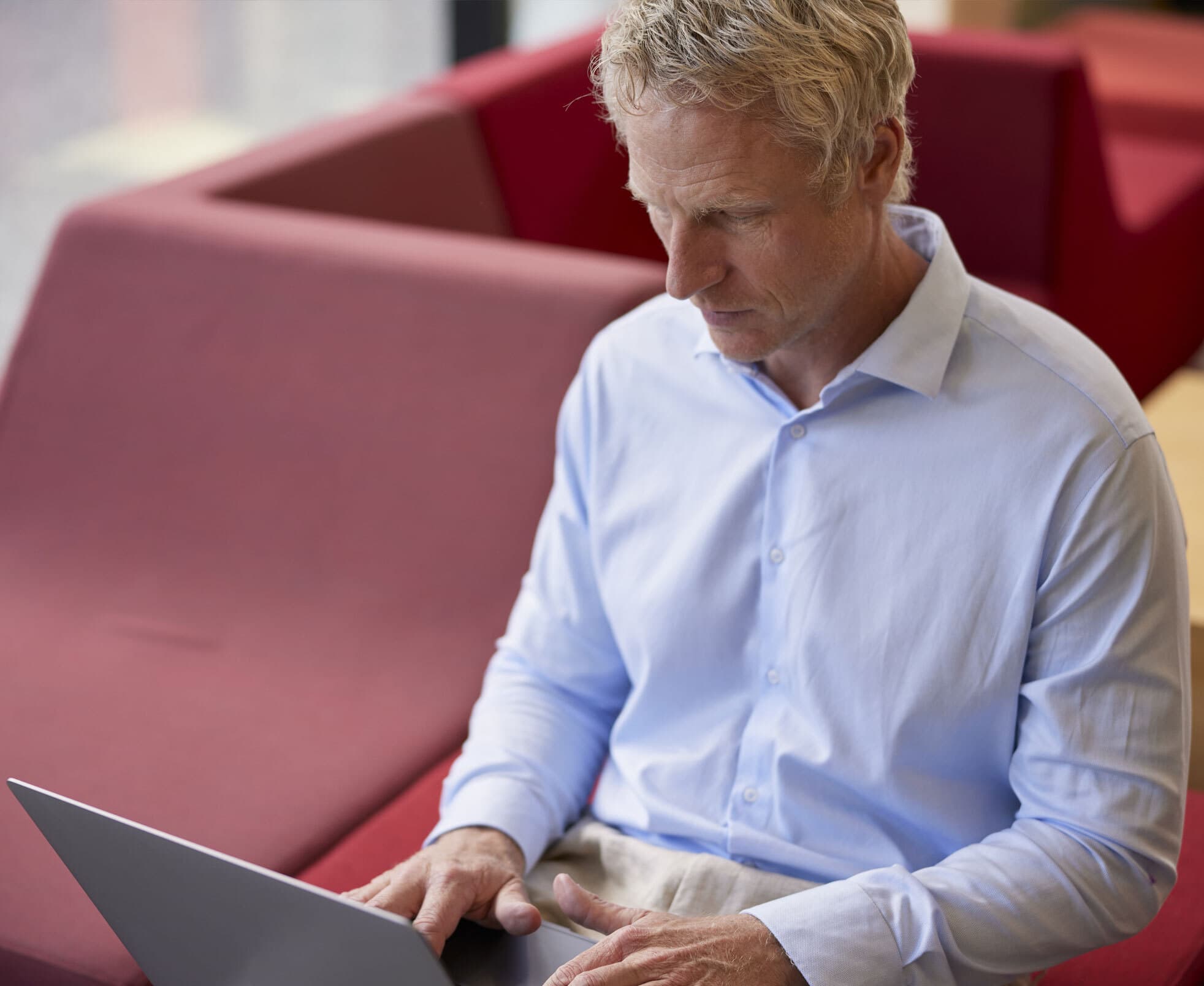 business man working at a computer in a co working space
