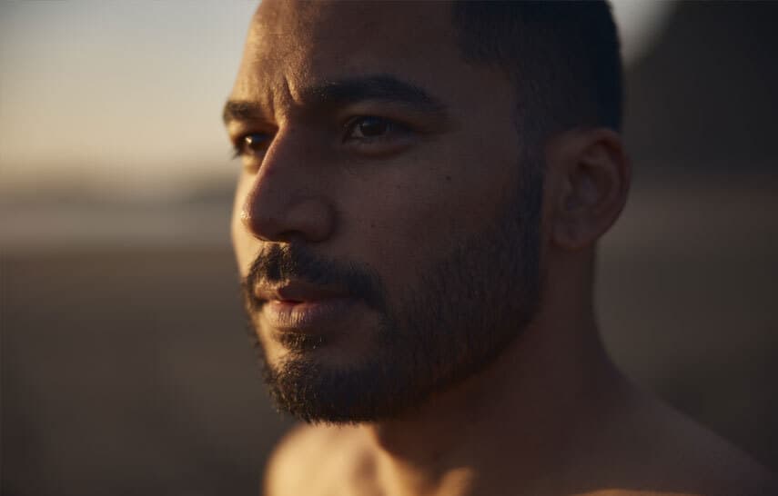 close up of a man's face at the beach