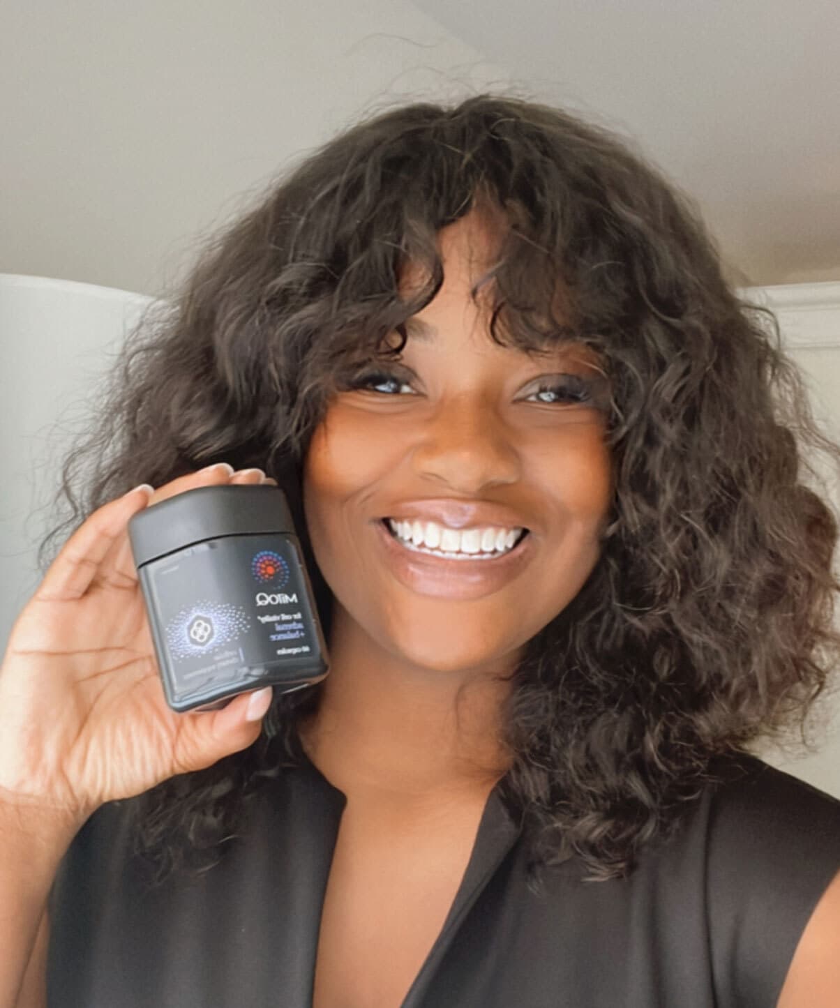 Brittany Giles holding MitoQ adrenal +balance