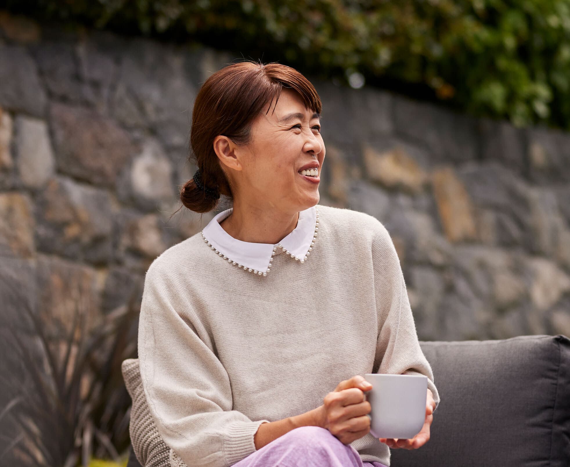 a woman smiling happily