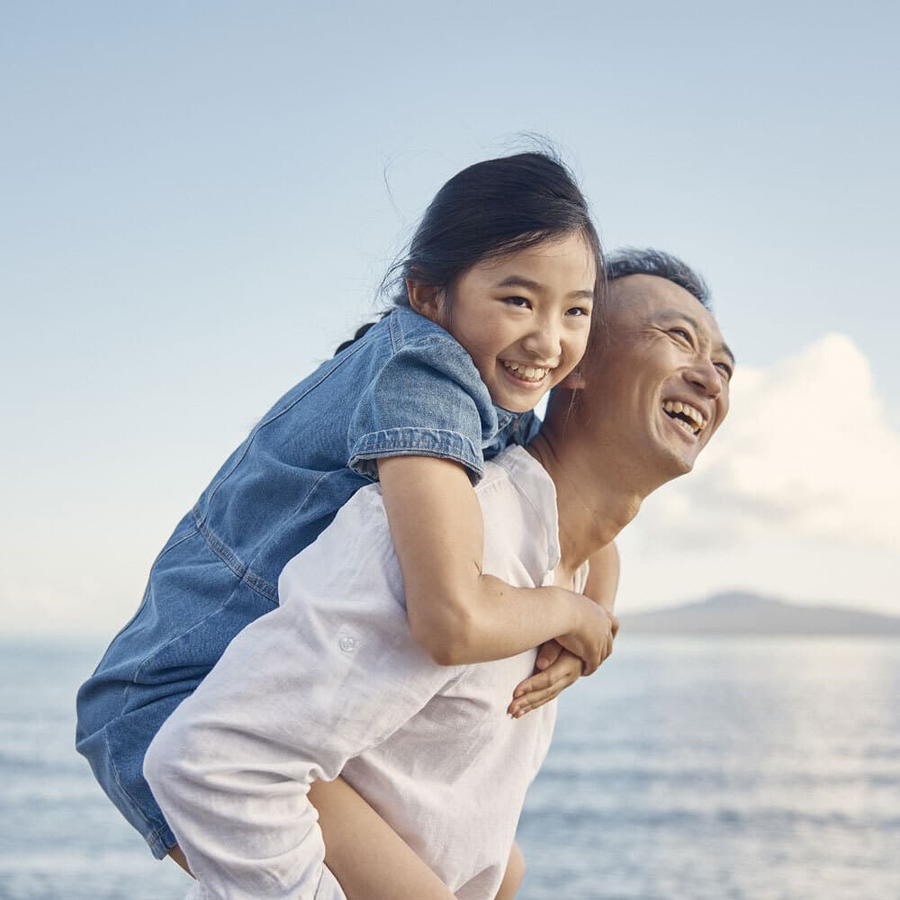Father and daughter on beach