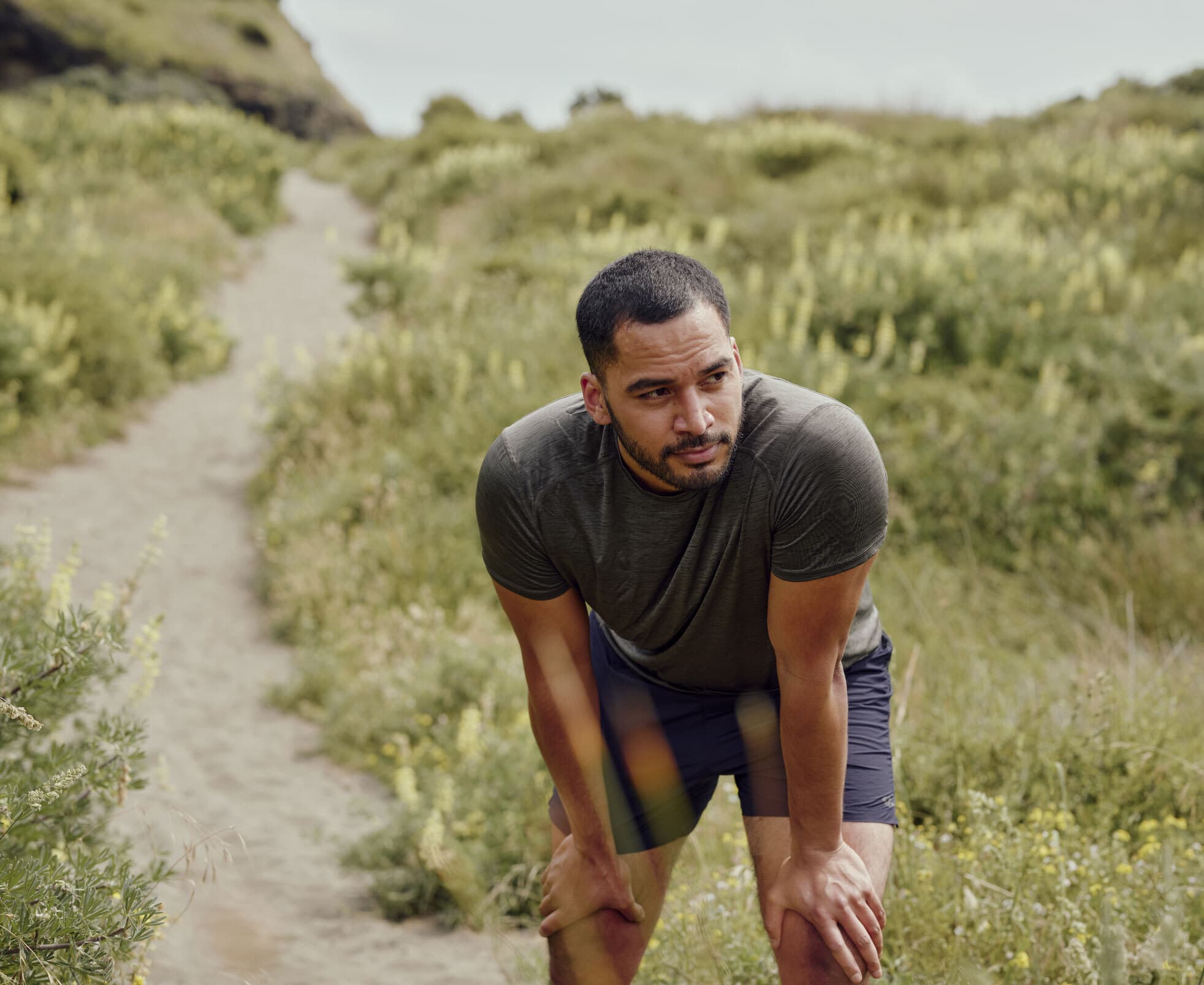 a man taking a breather from his daily run