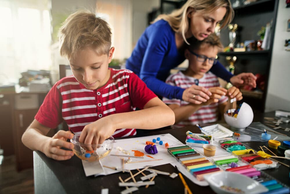 Mom and kids doing arts and crafts