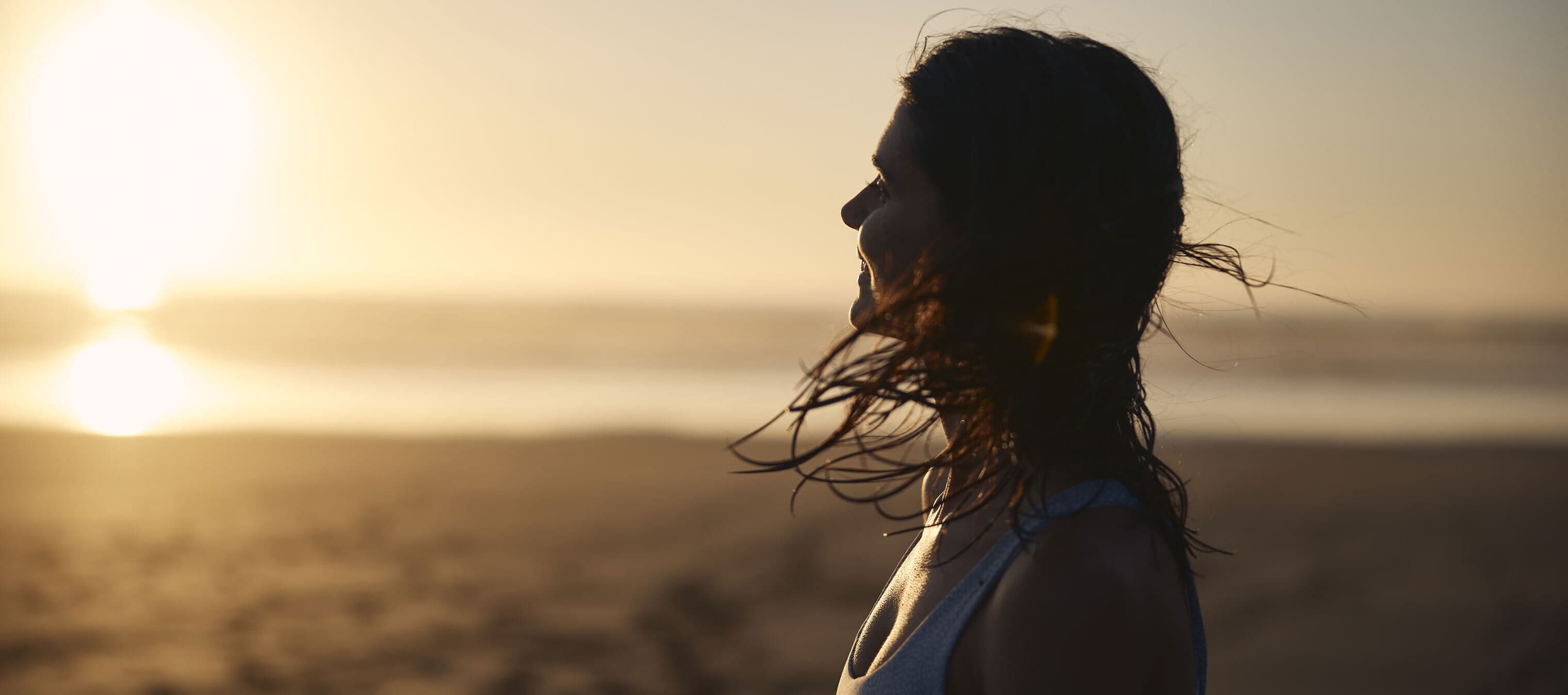 woman after swim at sunset