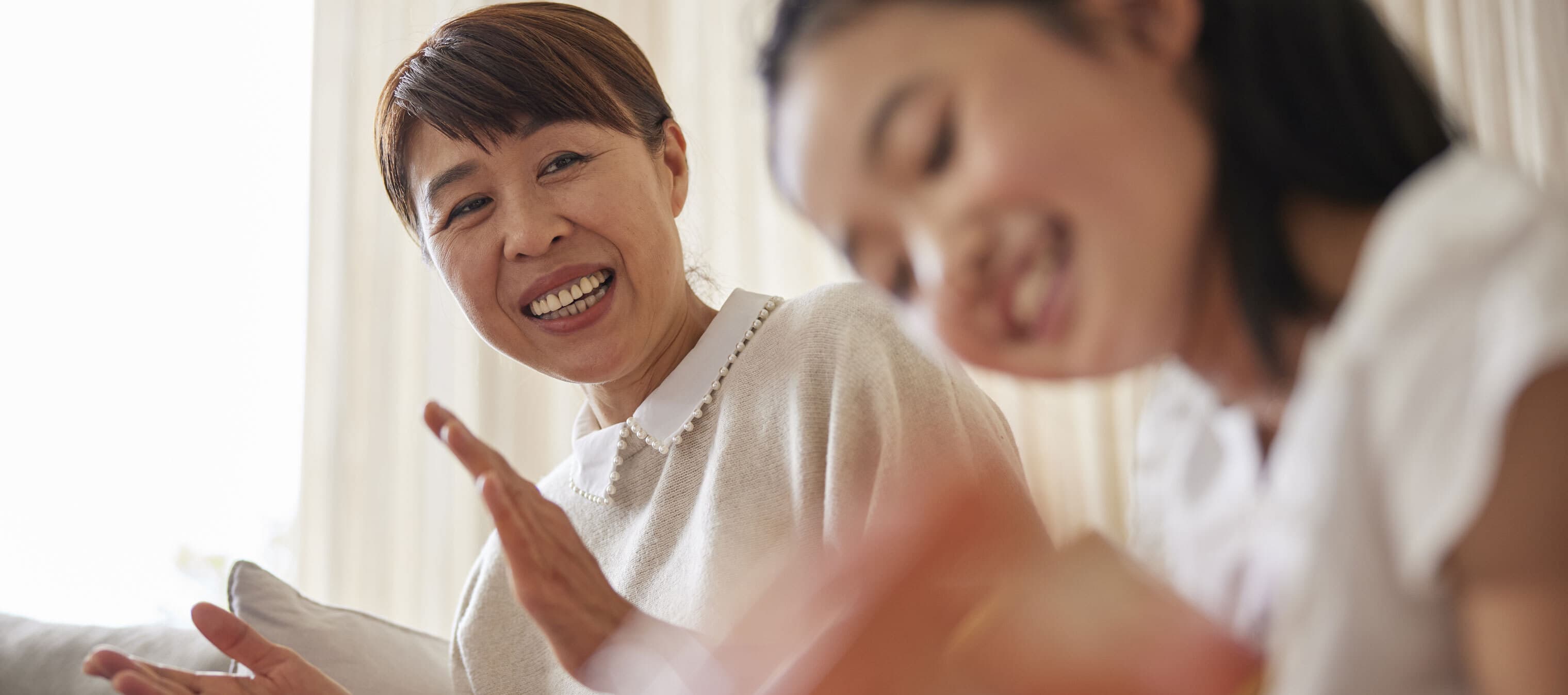 a woman sharing a happy moment with her daughter