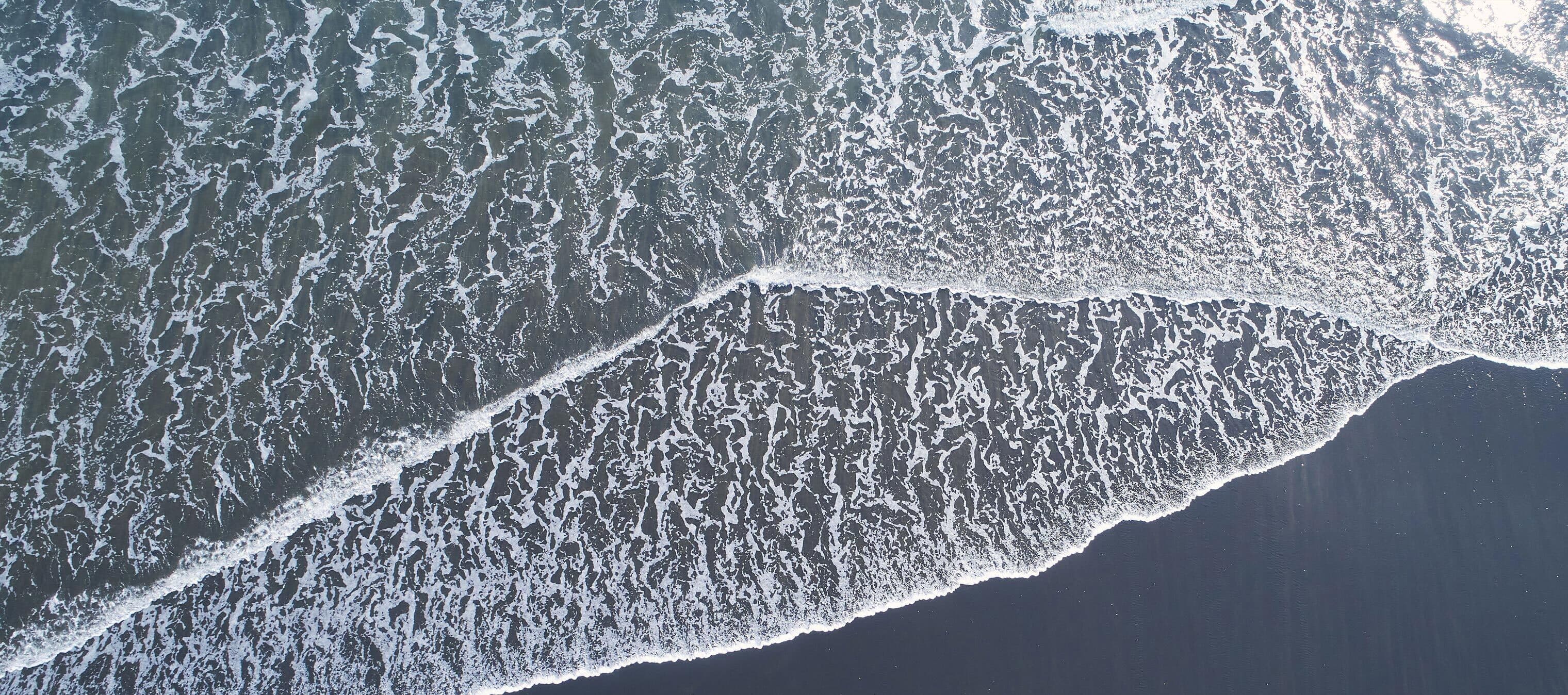 an image of washing crashing on a beach