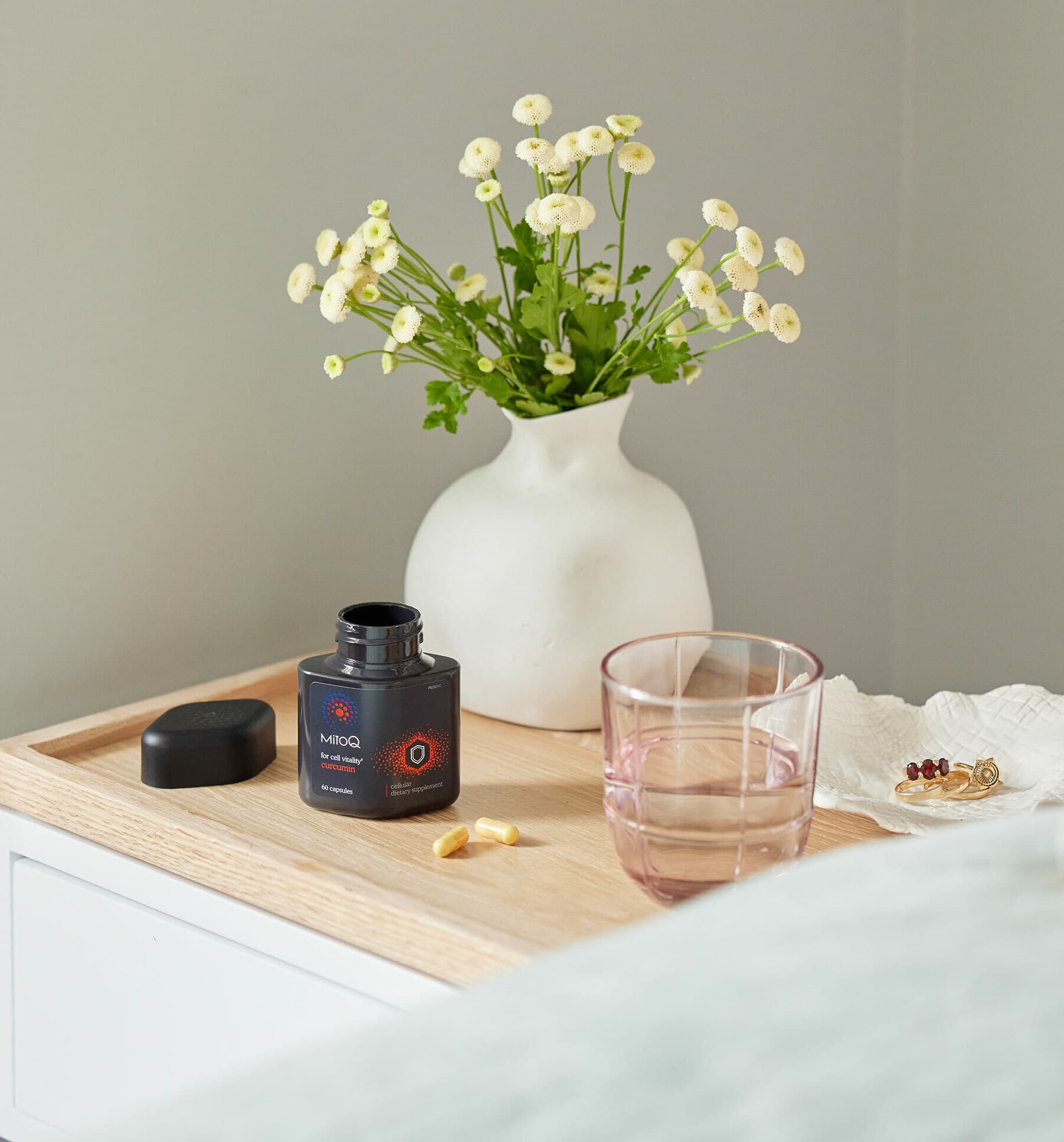 image of MitoQ curcumin next to the bed