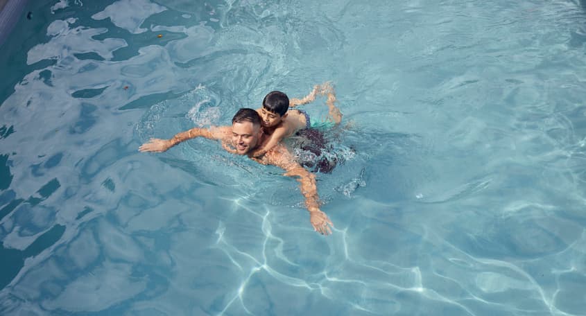 Father and son swimming