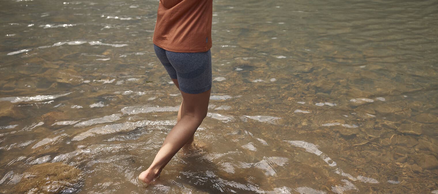Woman walking through water