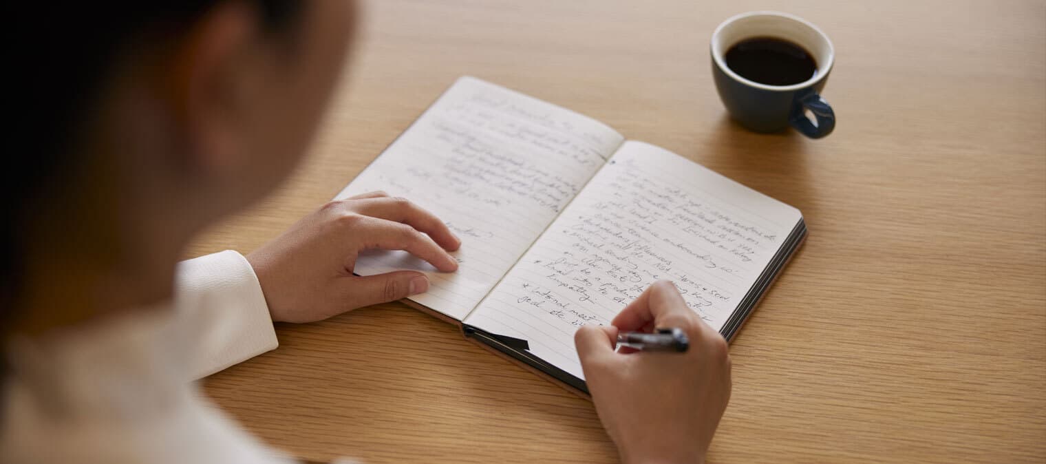 Writing and drinking coffee