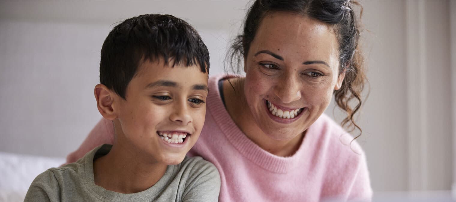 Mother and son smiling