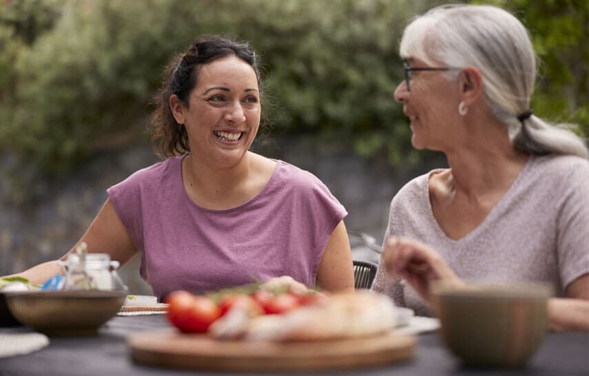 Grandmother and mother eating lunch