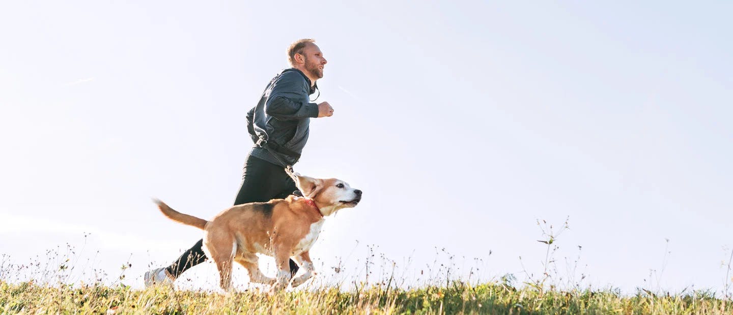 Man running with dog
