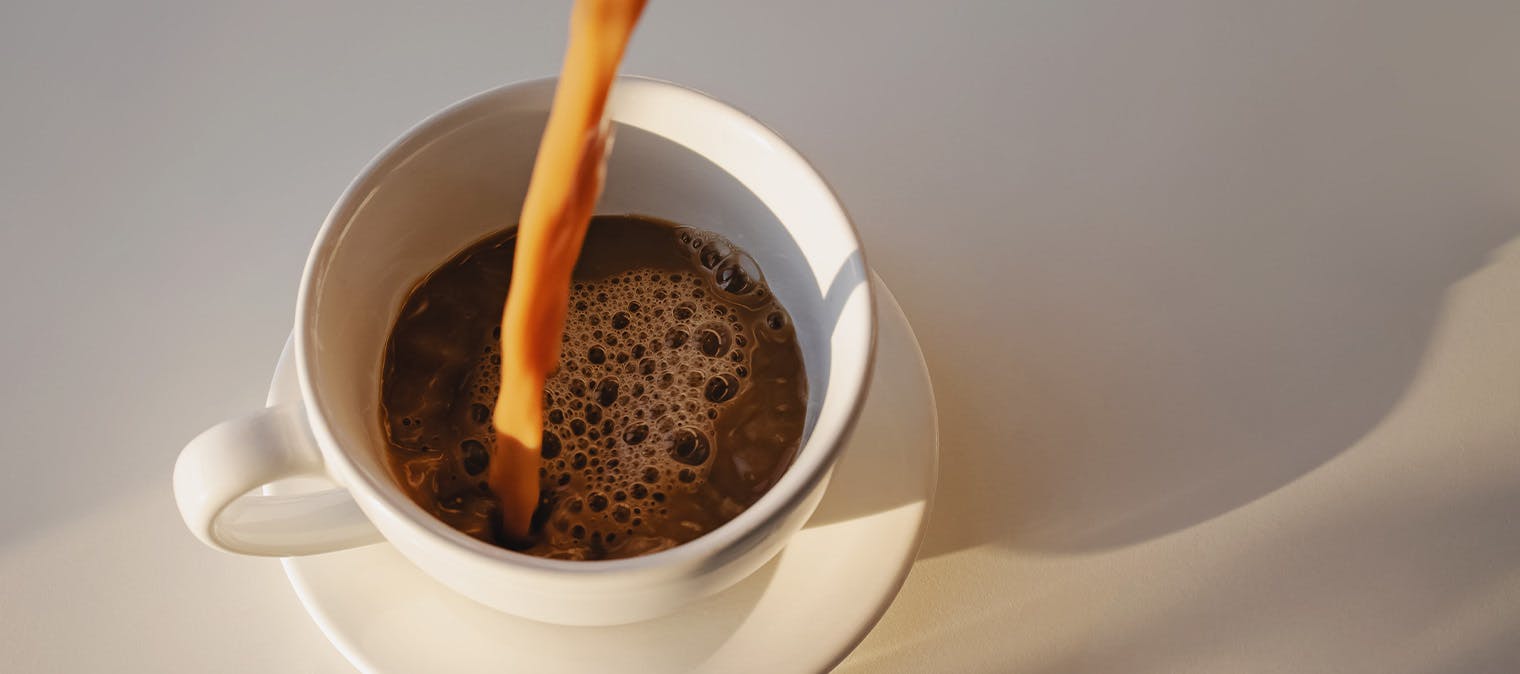 Coffee being poured into cup