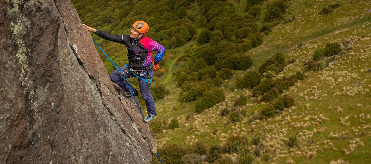 Nick Allen climbing a rock mountain