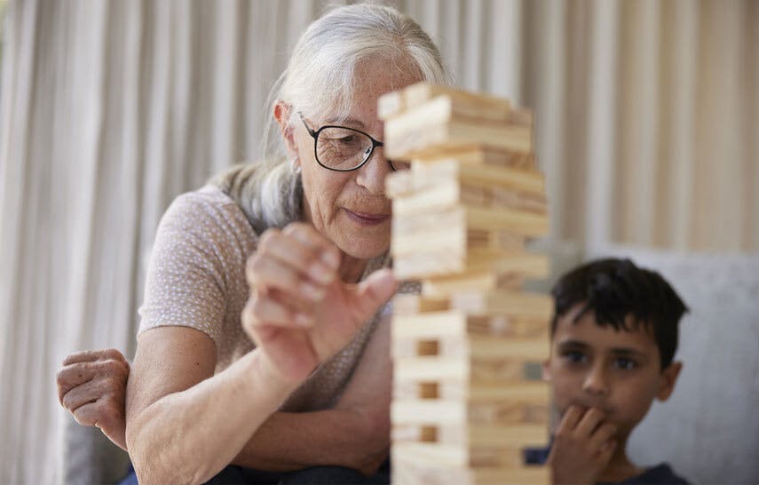 Grandmother and grandson playing Jenga