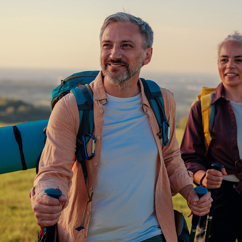 2 people with hiking sticks